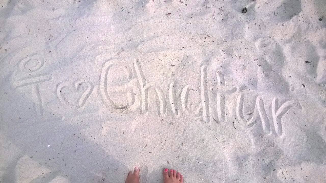 “I love GhidTur” written in white sand.