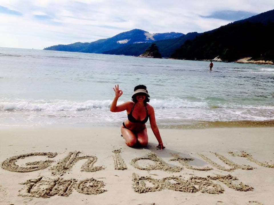 A holiday greeting: GhidTur written in the sand by the sea.