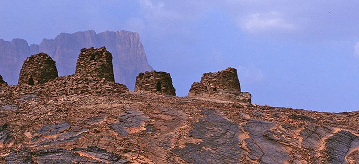 Оман: Camera: Fuji G617 Film: Kodak E100 VS The protohistoric site of Qubur Juhhal at Al Ayn lies near a palm grove in the interior of the Sultanate of Oman. Together with the neighbouring sites, it forms the most complete collection of settlements and nec